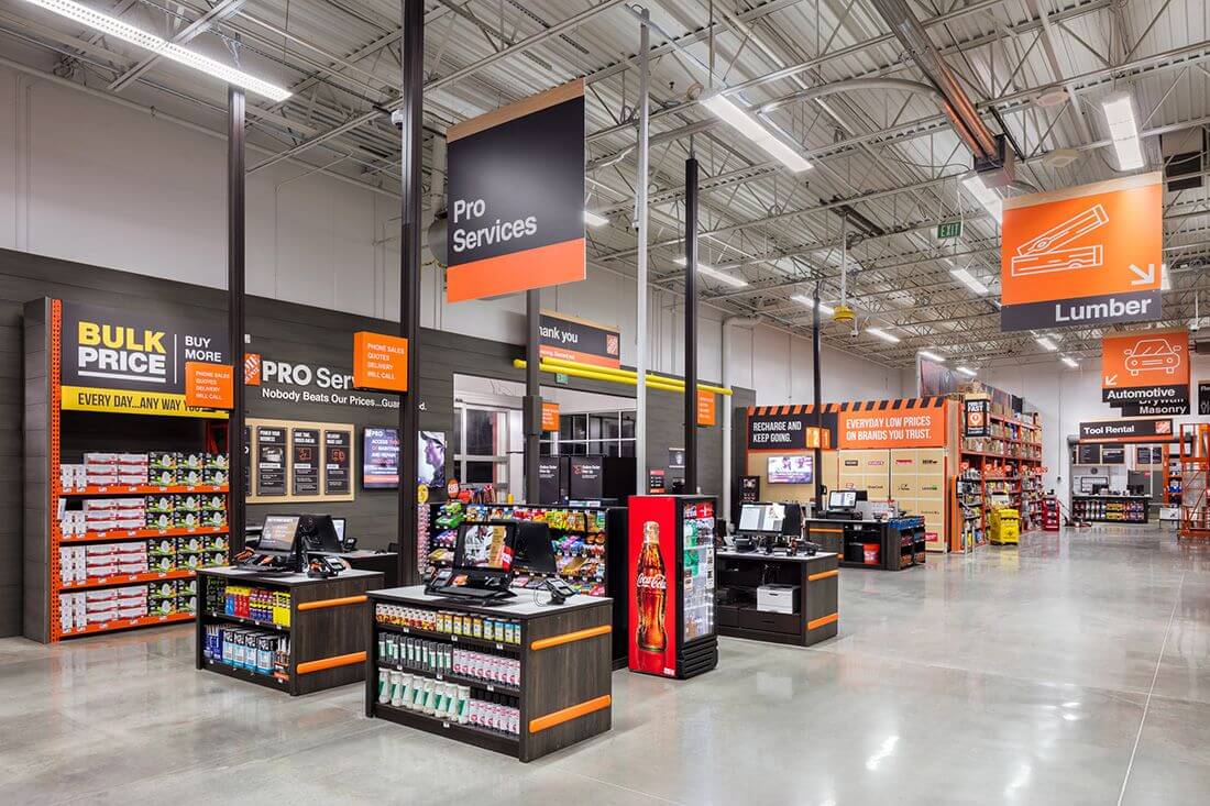 Interior of a hardware store featuring Pro Services and Bulk Price sections with various products displayed